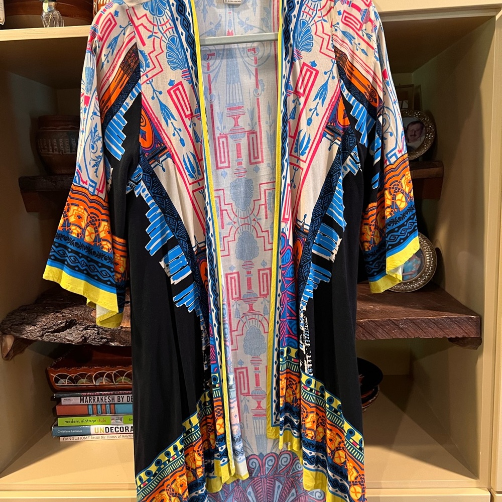 This is a “flying tomato” size M duster